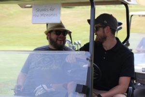 CSR employees driving golf cart